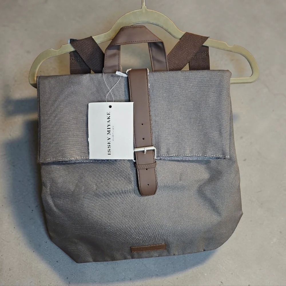Issey Miyake Parfums Gray Canvas Backpack Foldover Buckle NWT - Picture 2 of 4
